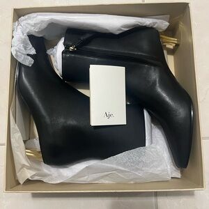 Aje Black and Gold Heeled Boots